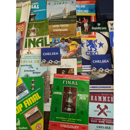 411 - A collection of football programmes and collectables, mainly Chelsea related to include Cup Final ex... 