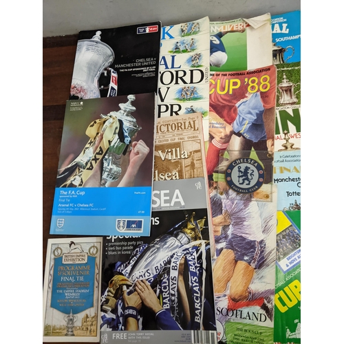 411 - A collection of football programmes and collectables, mainly Chelsea related to include Cup Final ex... 