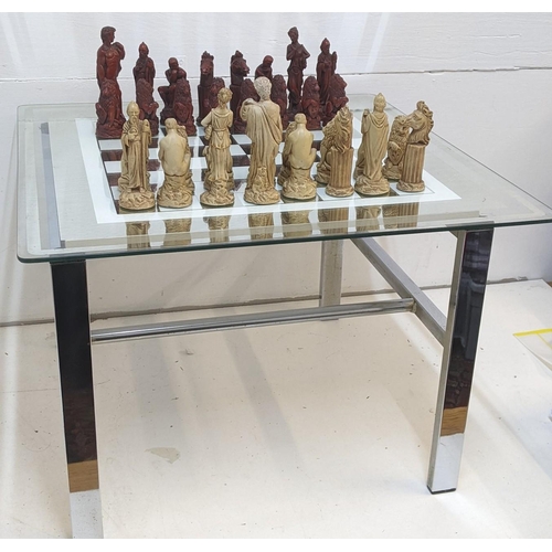 326 - A composition chess set and a chrome framed table with a glass box and checker board
Location:GR
If ... 