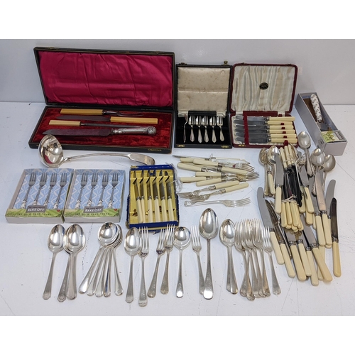 444 - Silver plated cutlery and flatware to include a soup ladle, a silver handled knife and other items
L... 