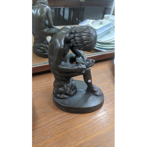 436 - A Bronze painted Grand Tour style sculpture fashioned as a seated boy assigned Austin prod to the ba... 