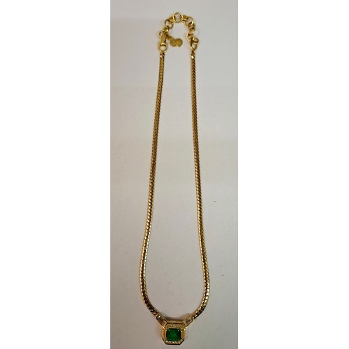 15 - Christian Dior- A gold tone, green stone and white crystal necklace having a CD charm to the fasteni... 