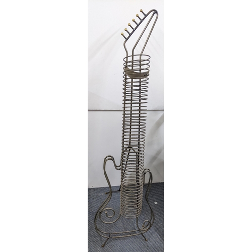 158 - A lacquered steel CD rack in the form of a guitar with an easel support back, 130cm h x 36.5cm w
Loc... 