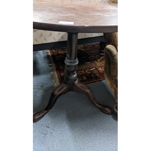 145 - A George III mahogany snap top occasional table on a three cabriole legs 67.5h x 74w
Location: A4B
I... 