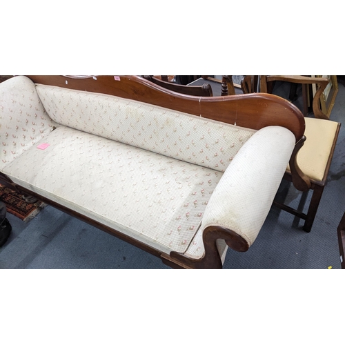 154 - A Victorian mahogany sofa having scroll formed arms and on castors, 89.5H x 200W
Location: A3B
If th... 