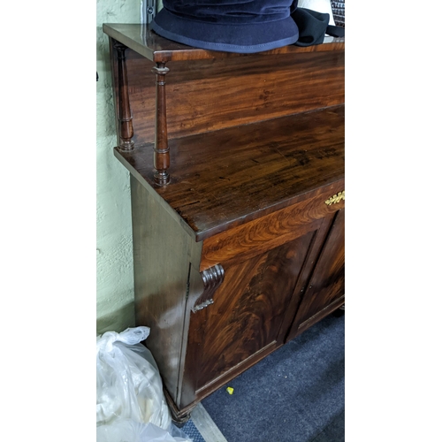 156 - A Regency mahogany chiffonier having a raised back, single drawer and two cupboards, 116H x 59W
Loca... 