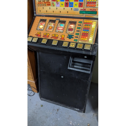 159 - An Adders & Ladders fruit machine, with original instructions and keys, adders and ladders lights no... 