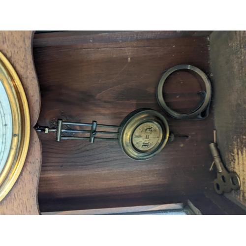 170 - An American cased mantel clock with Roman dial and pendulum marked 'R' and 'A', together with a maho... 