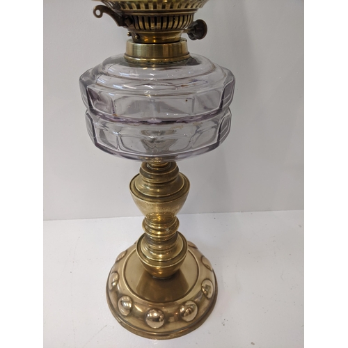 172 - A Victorian gas lamp on a rounded brass plinth with a green glass shade with floral design, 67cm hig... 