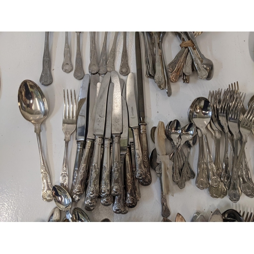 182 - A collection of silver plated kings pattern flatware to include teaspoons, a cadle, dinner forks and... 