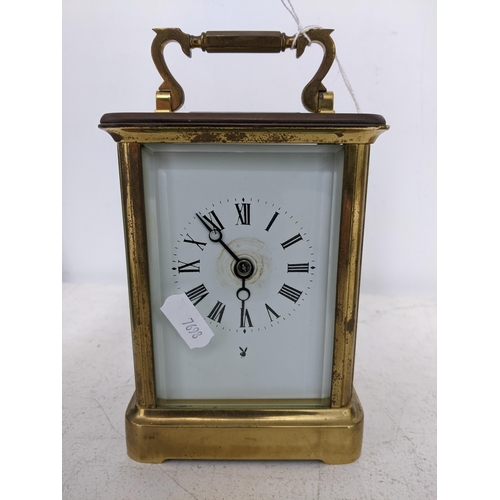 203 - A Charles Frodsham carriage clock, five window brass case, white enamel face with Roman numerals, mo... 