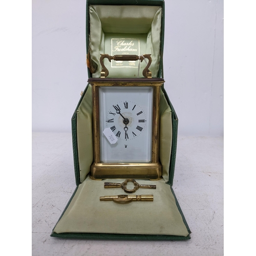 203 - A Charles Frodsham carriage clock, five window brass case, white enamel face with Roman numerals, mo... 