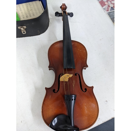 211 - A Rushworth & Dreaper two-part backed violin with case and bow A/F Location:
If there is no conditio... 