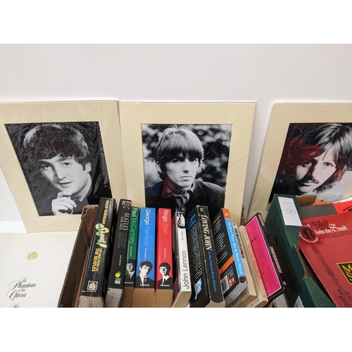 216 - A collection of music-related ephemera to include original Beatles books and sheet music, concert pr... 