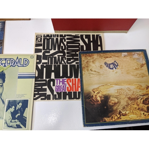 217 - A collection of approx. 60 1950s and 1960s LPs in two vintage cases to include artists such as Yardb... 