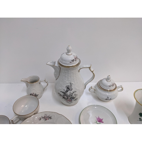 225 - A collection of Augarten porcelain to include vases, candlesticks, dishes and other items, and a Ros... 