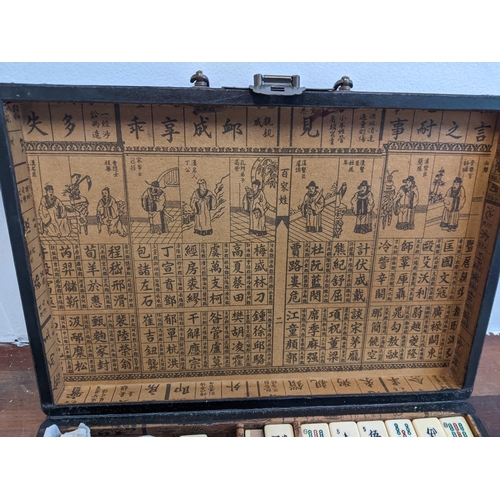 238 - A Chinese Mahjong set in a lacquered case Location: 3.1
If there is no condition report shown, pleas... 