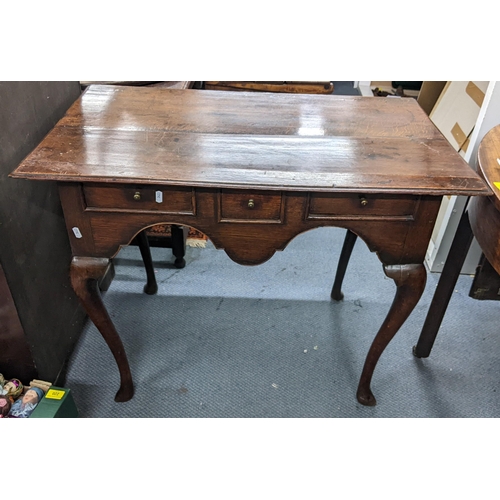 314 - A George II oak lowboy having three drawers and on cabriole legs, 72.5cm h x 92cm w
Location:A2M
If ... 