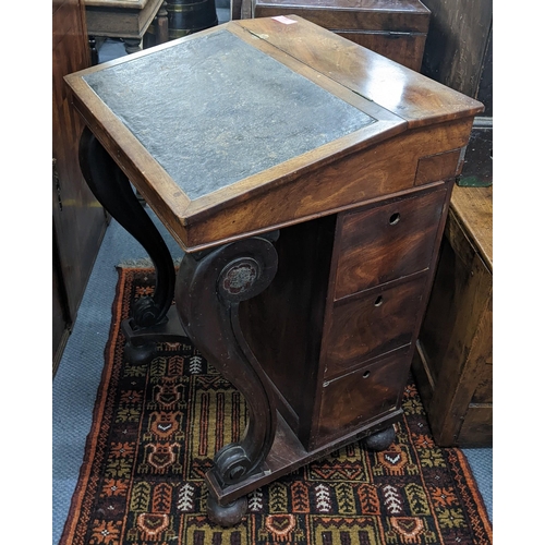 321 - A Victorian mahogany Davenport having scrolled supports with drawers to one side, 85.5cm h x 58.5cm ... 