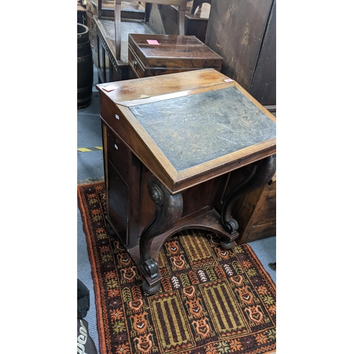 321 - A Victorian mahogany Davenport having scrolled supports with drawers to one side, 85.5cm h x 58.5cm ... 