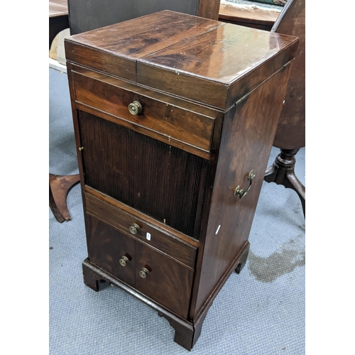 322 - A George III mahogany wash stand, the top opening to reveal a fitted interior and having a tambour d... 