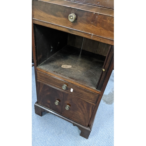 322 - A George III mahogany wash stand, the top opening to reveal a fitted interior and having a tambour d... 