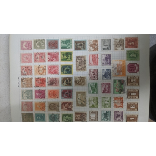 338 - A quantity of stamps from around the world mounted in various albums, some loose, along with various... 