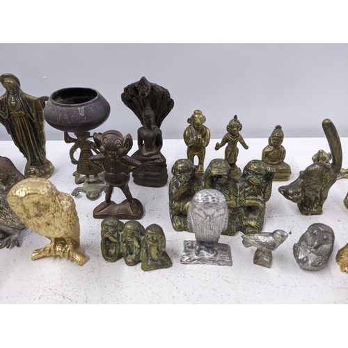 449 - A collection of metal figures and animals including a Chinese bronze figure of an elder, Tibetan Bud... 