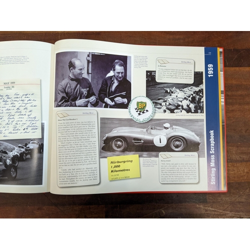 493 - A Stirling Moss scrapbook 1956-1960 by Stirling Moss & Phillip Porter in a protective red sleeve
Loc... 