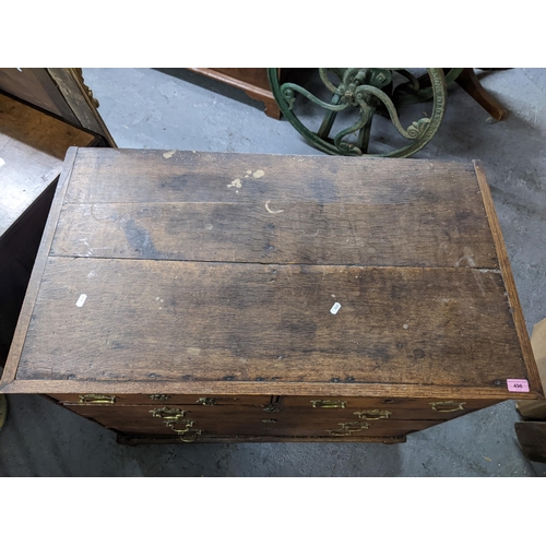 496 - A late 19th/early 20th century oak chest of drawers with two short, three long lockable drawers with... 