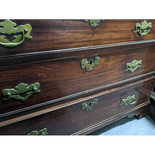 498 - An early 20th century mahogany bureau with a fall flap revealing an interior racking and drawers, wi... 