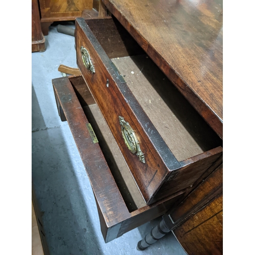 502 - A 19th century bow fronted sideboard with two long drawers, flanked by two deep drawers with brass h... 