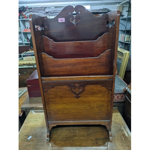 504 - An early 20th century five drawer mahogany dressing chest with a protective glass layer along with a... 