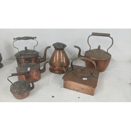 524 - A collection of Victorian copper kettles to include ships kettle and others with a half gallon coppe... 