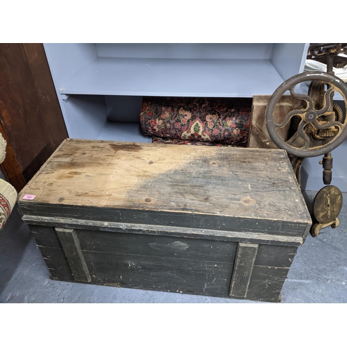 333 - A vintage wooden tool chest containing various woodworking tools, and a cast iron American drill Loc... 