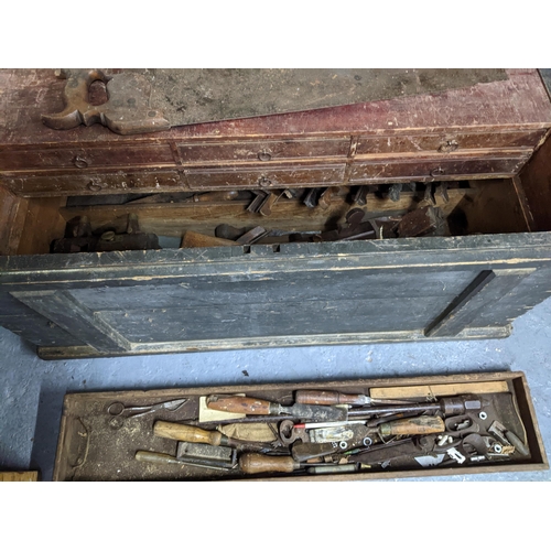 333 - A vintage wooden tool chest containing various woodworking tools, and a cast iron American drill Loc... 