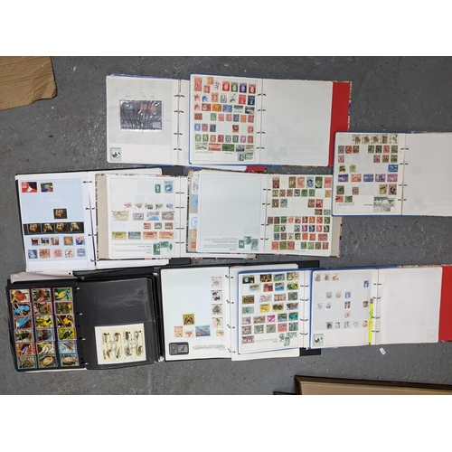 336 - A collection of worldwide stamps mounted in nine albums to include GB stamps, Chinese, Norwegian, Sp... 