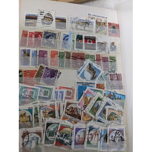 338 - A quantity of stamps from around the world mounted in various albums, some loose, along with various... 