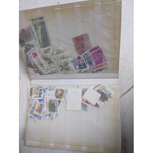 338 - A quantity of stamps from around the world mounted in various albums, some loose, along with various... 