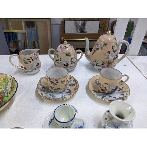 360 - A Japanese eggshell bachelor's tea set with other Oriental items, a small mother of pearl spoon, fis... 