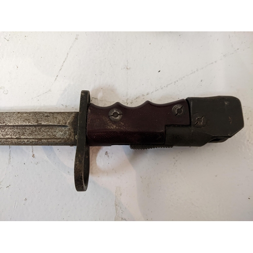 305 - A British Bayonet no 7 MK1/L with swivel barrel attachment to the handle along with another longer b... 