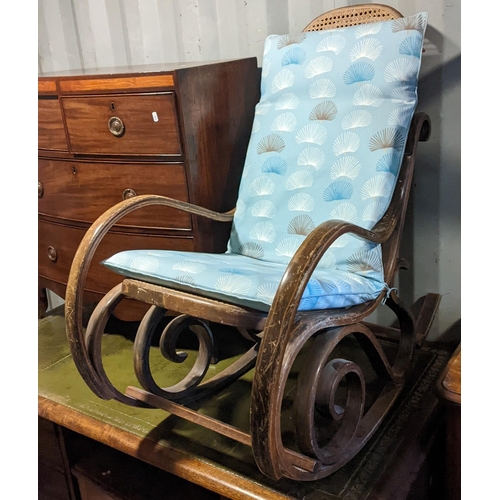 310 - An early 20th century bentwood can upholstered Thonet style rocking chair
Location: RC
If there is n... 