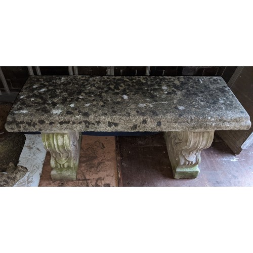 165 - A garden stoneware bench having a rectangular seat and with two scroll formed pedestals 45cm h x 97c... 