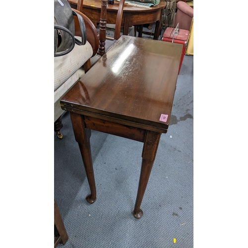 162 - An 18th century mahogany fold over tea table having a single drawer and on pad feet 74cm h x 76cm w ... 