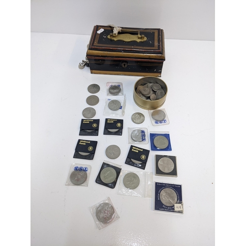 242 - A collection of coins to include various post WWII British circulated shillings, two shilling pieces... 