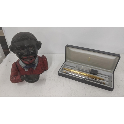 246 - An early 20th century cast iron money box together with a Parker propelling pencil with box and one ... 