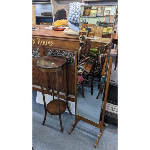 293 - An early 20th century mahogany torchiere stand together with a cheval swing mirror
Location: A1M/A2M... 