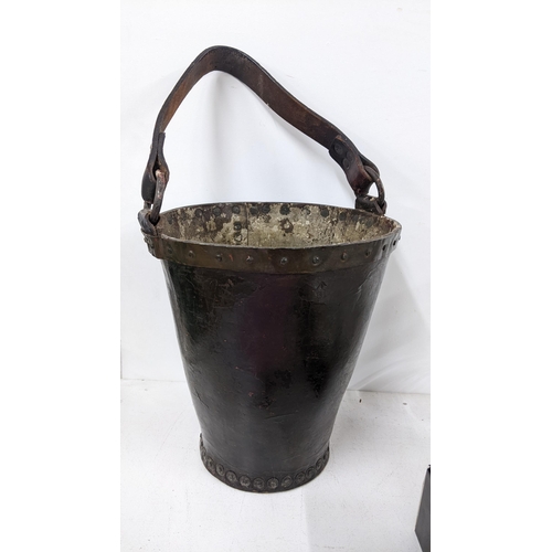 294 - A 19th century leather and studded fire bucket with a leather handle, 30cm h excluding handle
Locati... 