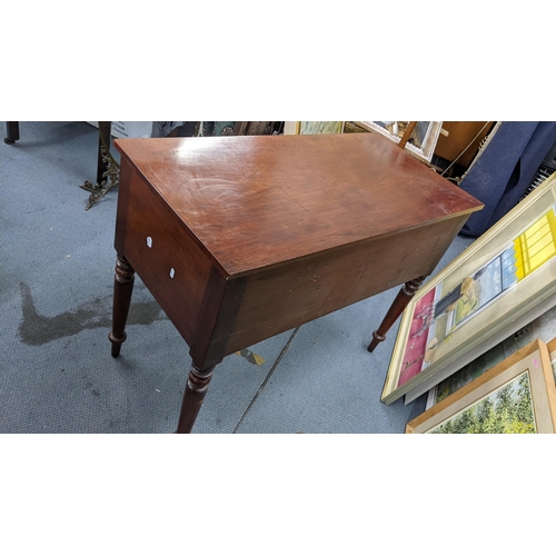 296 - An early 20th century kneehole desk having a drawer flanked by cupboards and on turned legs, 76cm h ... 