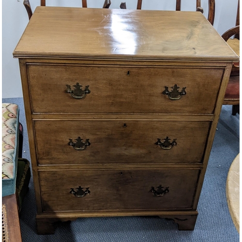 301 - An early 20th century walnut three drawer chest having brass drop handles and on bracket feet, 91.5c... 